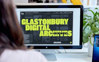 The Glastonbury Digital Archive shown on a iMac screen, over the shoulder
