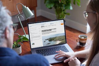 A website being edited in Craft CMS, on a laptop screen, photograph taken over someones shoulder