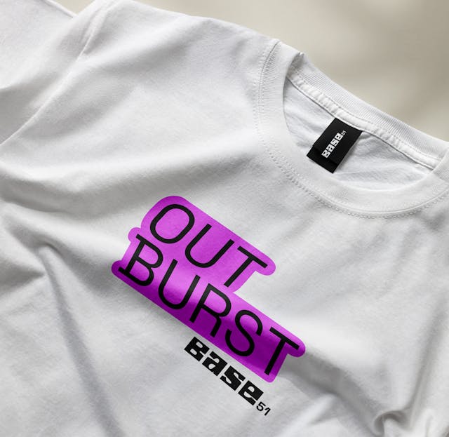 Mockup of a t-shirt for a Base 51 sub-branded event called 'Outburst'