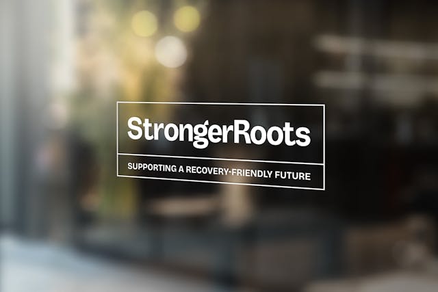StrongerRoots logo on a glass window with the strapline “Supporting a recovery-friendly future.”