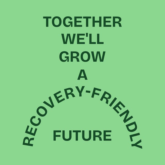 Smiling person wearing glasses in a bright market space, representing positivity and confidence in recovery.