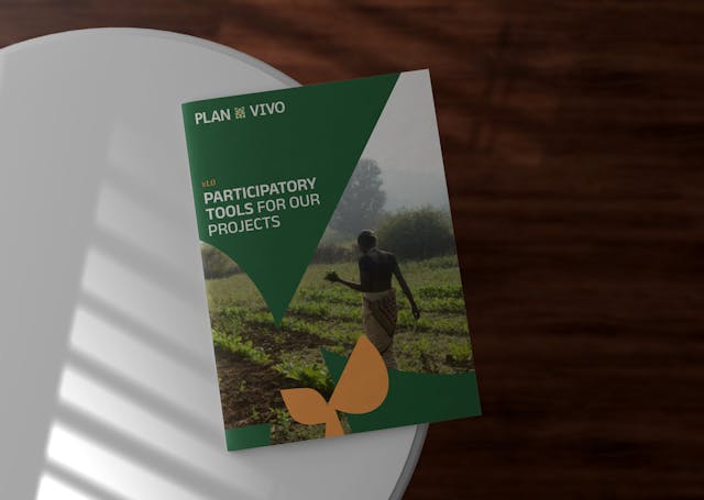 The cover of a Plan Vivo document, on a table